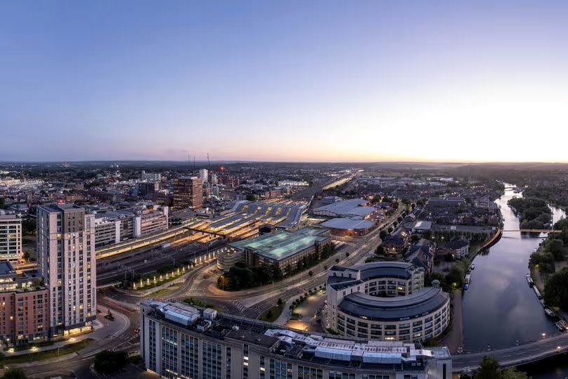 Reading at dusk, seen from above: the station, the town centre and the river.